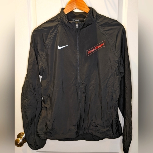 Nike Jackets & Blazers - NIKE black lightweight running jacket size medium red stripe logo